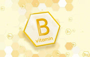 Vitamin B12 symbol with honeycomb pattern on a yellow background